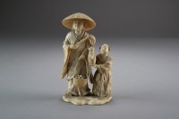 Lot 504 - A Japanese ivory okimono of a street vendor...