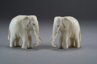 Lot 505 - A pair of carved ivory figures of elephants,...