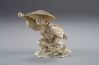 Lot 516 - A Japanese ivory okimono of a farmer, Meiji...