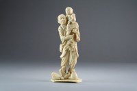 Lot 521 - A Japanese ivory okimono of a farmer and his...