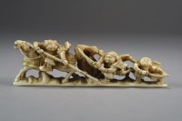 Lot 525 - A Japanese ivory okimono of warriors, Meiji...