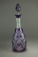 Lot 550 - A large amethyst cut glass decanter and...