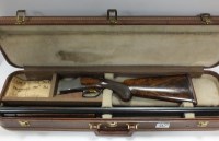 Lot 590 - A 12 bore over and under ejector shotgun by...