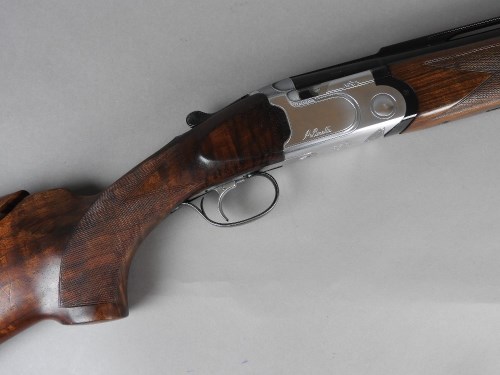 Lot 598 - A 12 bore over and under ejector shotgun by...