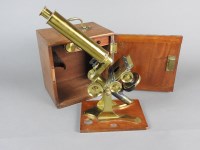 Lot 619 - A brass compound microscope by Salmon, third...