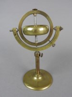 Lot 634 - A brass and steel demonstrational gyroscope on...