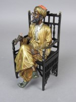 Lot 712 - A Franz Bergman cold painted bronze of an Arab...