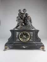 Lot 735 - A French black marble mantle clock, 19th...