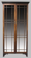 Lot 763 - A mahogany free standing cabinet bookcase,...