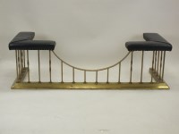 Lot 765 - A brass club fender 20th century, typical...