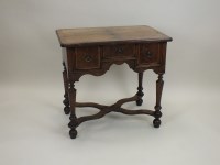 Lot 769 - A figured walnut lowboy, William and Mary and...