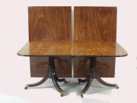 Lot 777 - A mahogany twin pillar dining table, George...