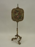 Lot 778 - A gilt gesso and brass pole screen 19th...
