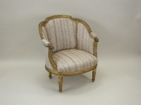 Lot 783 - A Louis XVI style giltwood tub chair, late...
