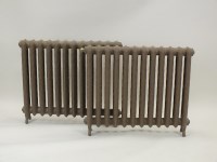 Lot 793 - A pair of cast iron freestanding radiators,...