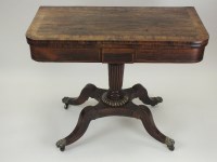 Lot 804 - A Regency rosewood cross banded card table,...