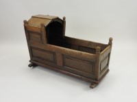 Lot 808 - A panelled oak crib, 18th century, with canted...