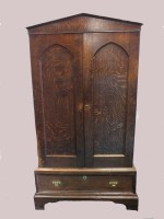 Lot 810 - An oak two door cabinet, early 19th century,...