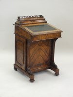 Lot 817 - A Victorian figured walnut Davenport, third...