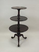 Lot 844 - A mahogany dumb waiter, 19th century, with...