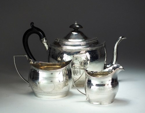 Lot 12 - A matched three piece silver tea service,...