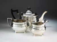 Lot 14 - A three piece silver tea service, William...