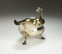Lot 18 - A George III silver sauce boat, William Skeen,...