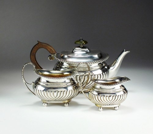 Lot 24 - A Victorian three piece silver tea service,...