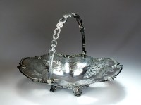 Lot 27 - A Victorian swing handled silver cake basket,...