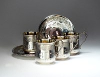 Lot 38 - A set of four French silver cups and saucers,...