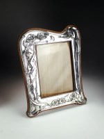 Lot 48 - An Art Nouveau silver mounted photograph frame,...