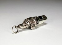 Lot 95 - A novelty silver whistle in the form of a dogs...