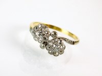 Lot 139 - A floral diamond cluster ring, designed as two...