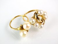 Lot 144 - A cultured pearl crossover ring, the yellow...