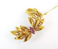 Lot 147 - An 18ct gold ruby spray brooch, designed as a...