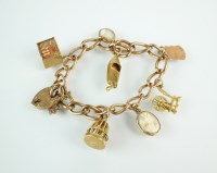 Lot 149 - A yellow metal curb link bracelet, stamped...