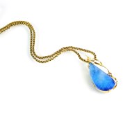 Lot 164 - A boulder opal and diamond pendant, the drop...