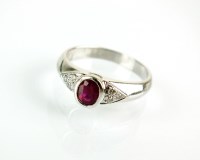 Lot 165 - A ruby and diamond ring, designed as a central...