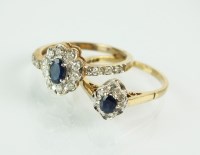 Lot 166 - A 9ct gold sapphire and diamond oval cluster...