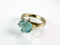 Lot 169 - An 18ct white gold single stone aquamarine...