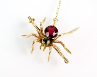 Lot 177 - An early 20th century ruby and peridot spider...