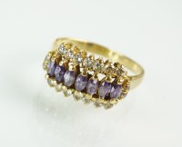 Lot 178 - An amethyst and white stone cluster ring, the...