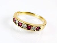 Lot 179 - An 18ct gold seven stone ruby and diamond ring,...