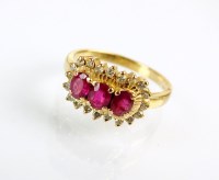 Lot 185 - An 18ct gold ruby and diamond cluster ring,...