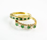 Lot 189 - An 18ct gold emerald and diamond half hoop...