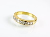 Lot 190 - An 18ct gold seven stone Princess cut diamond...