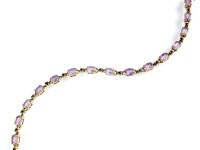 Lot 192 - A 9ct gold amethyst and sapphire bracelet,...