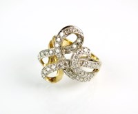 Lot 195 - A 9ct gold diamond dress ring, designed as...