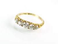 Lot 204 - A five stone graduated diamond ring, the five...