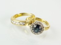 Lot 212 - An 18ct gold sapphire and diamond cluster ring,...